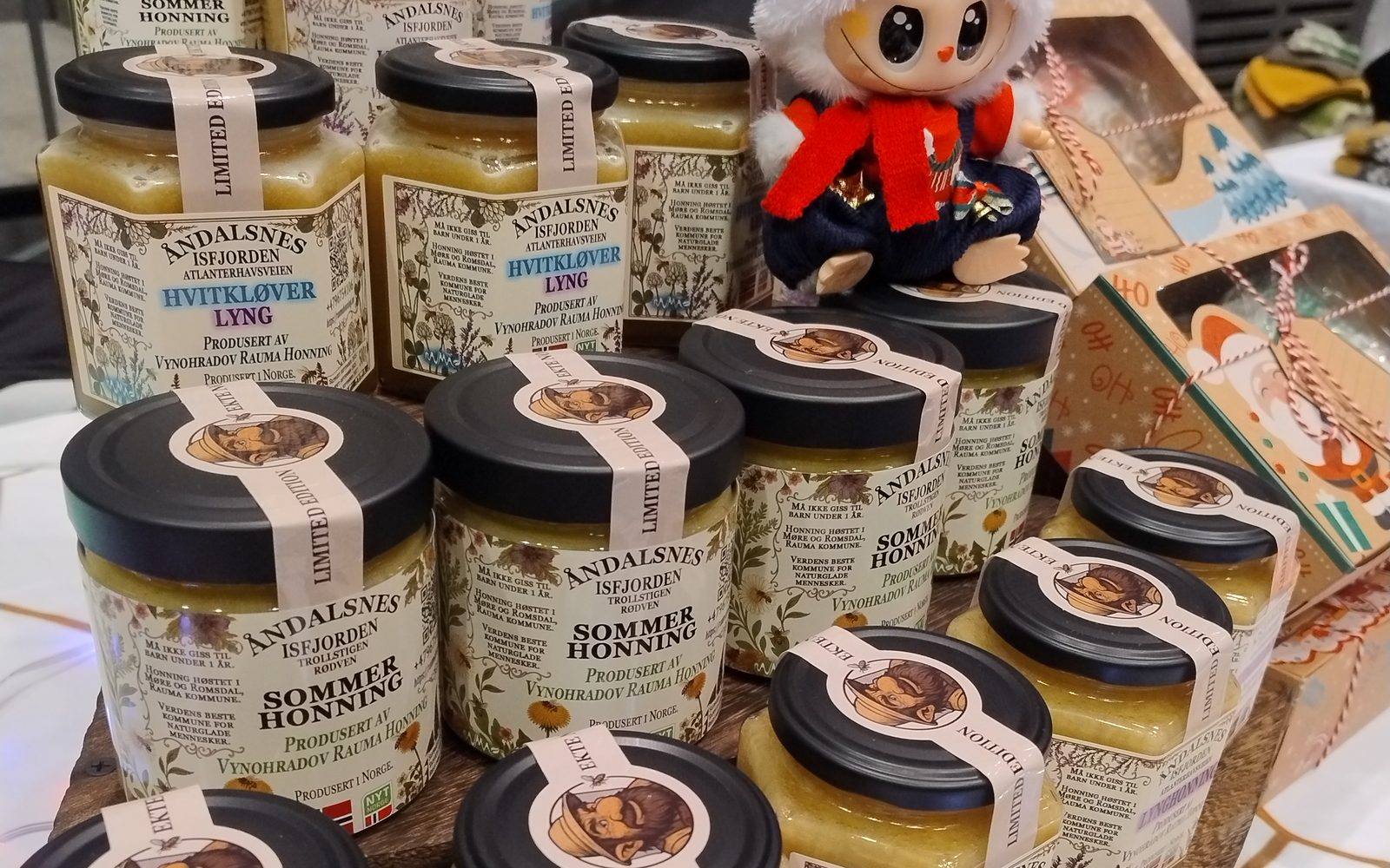 Jars of Rauma Honning Norwegian honey on display at a local market in Åndalsnes, Norway